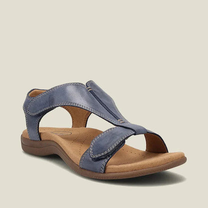 Sandalia ortopédica ergonómica azul claro, con tira superior y suela marrón acolchada.