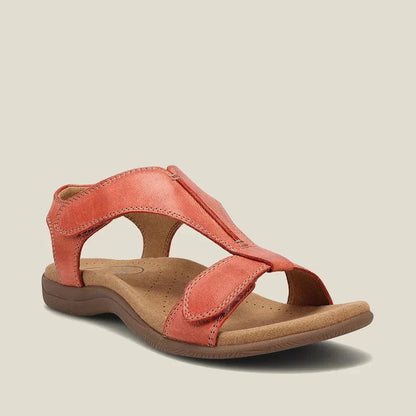 Sandalias ergonómicas coral de ante, con cierre ajustable y suela acolchada.