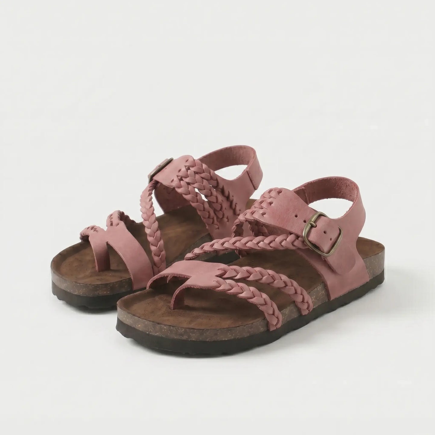 Sandalias ortopédicas rosa oscuro con correas trenzadas y hebilla metálica