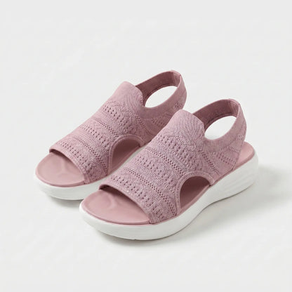 Sandalias ortopédicas de tejido rosa, punta abierta y suela blanca acolchada