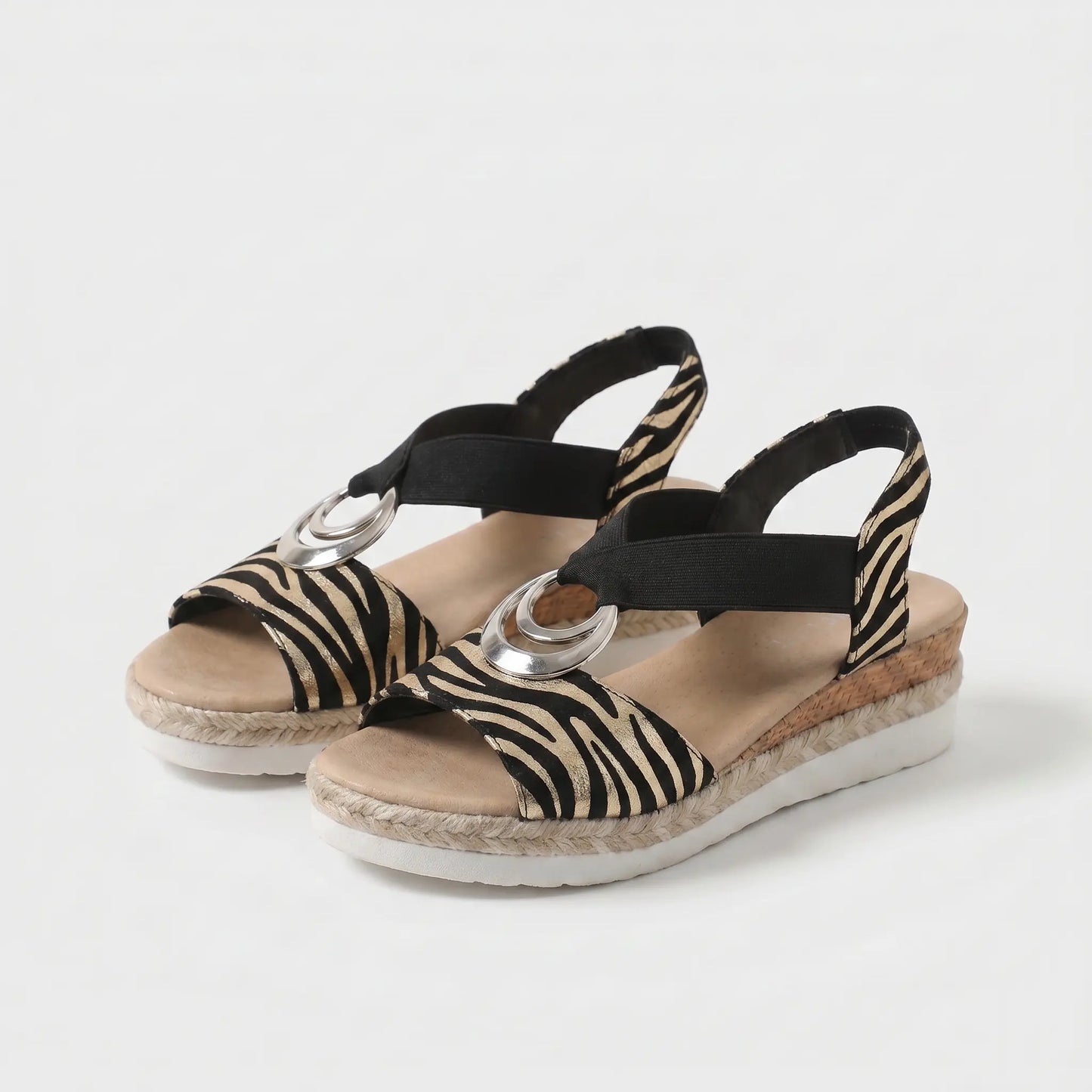 Sandalias ortopédicas con estampado cebra negro y beige y hebilla plateada