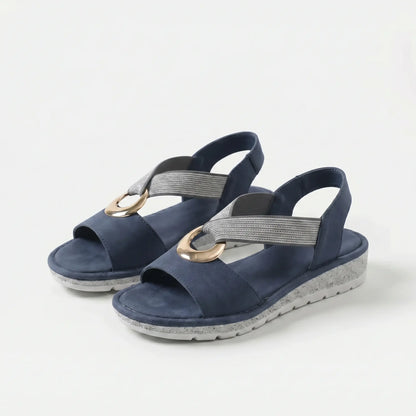 Sandalias ortopédicas confort azules con tira elástica gris y hebilla metálica