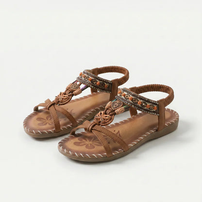 Sandalias ortopédicas marrón con tiras decoradas y suela acolchada con costuras
